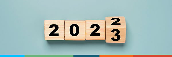 Image of the year 2022 turning into 2023 illustrated with wooden blocks