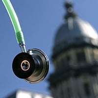 Picture of stethoscope in front of a legislative building